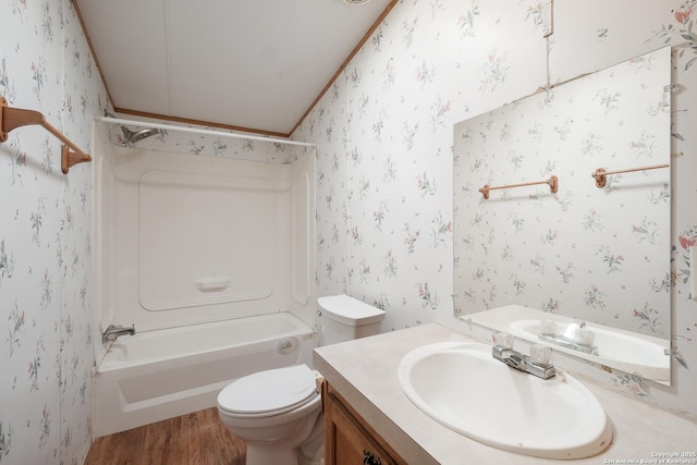 full bathroom featuring vanity, crown molding, shower / tub combination, hardwood / wood-style floors, and toilet