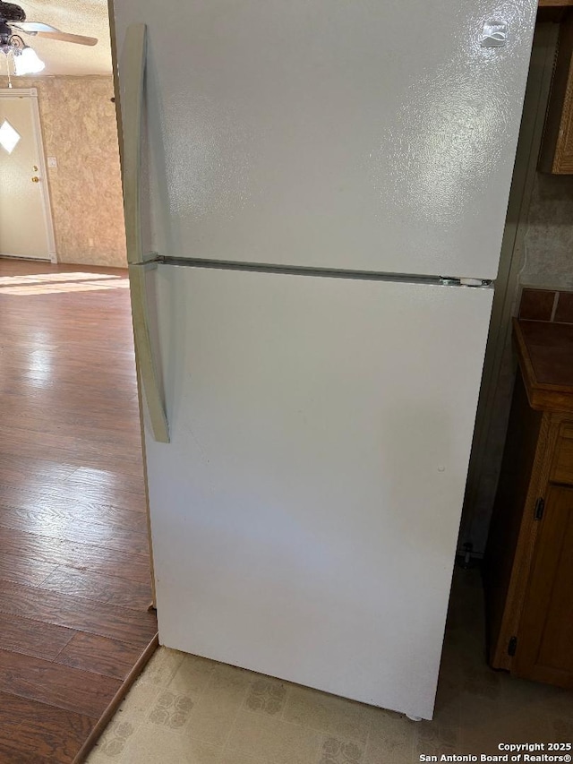 kitchen featuring ceiling fan and white fridge