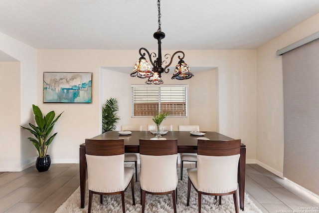 dining space featuring a notable chandelier