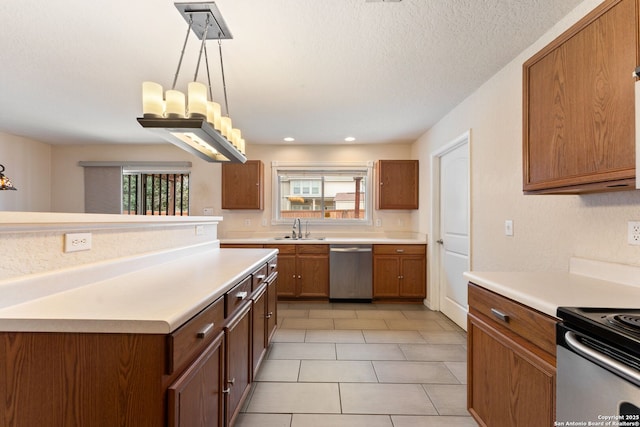 kitchen featuring dishwasher, sink, hanging light fixtures, a textured ceiling, and light tile patterned floors