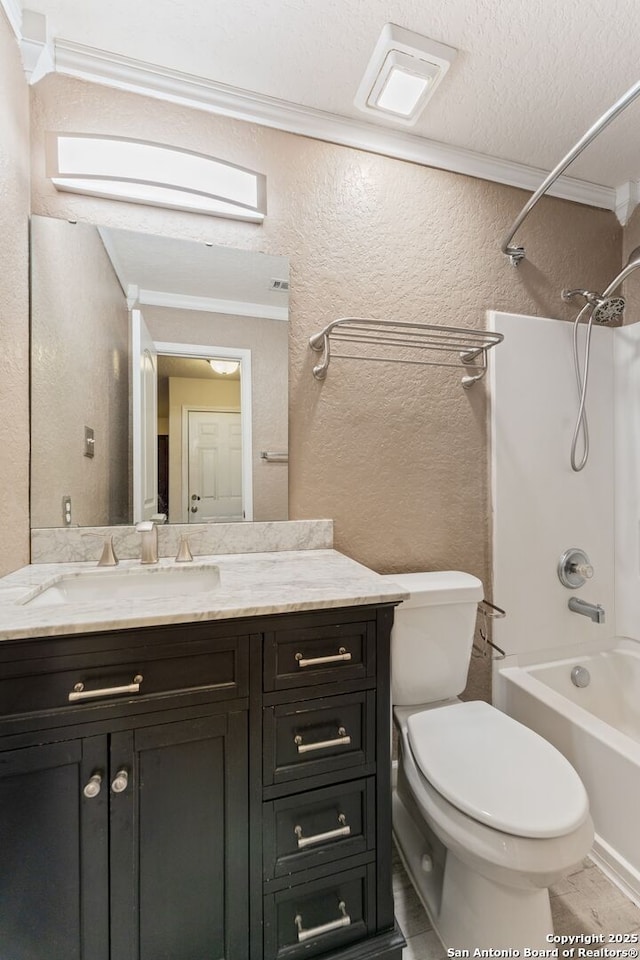 full bathroom with vanity,  shower combination, crown molding, toilet, and a textured ceiling