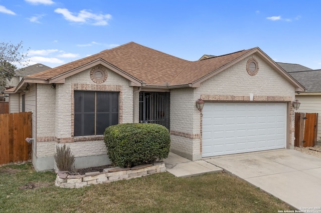 single story home featuring a front yard and a garage