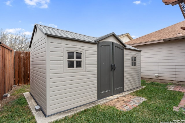 view of outdoor structure with a lawn