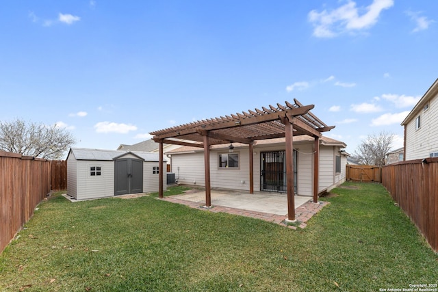 back of property featuring a pergola, a patio, a shed, and a lawn