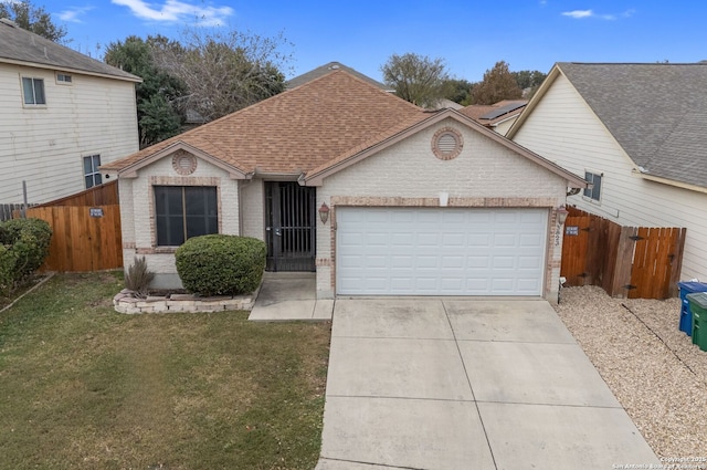 view of front facade featuring a garage and a front lawn