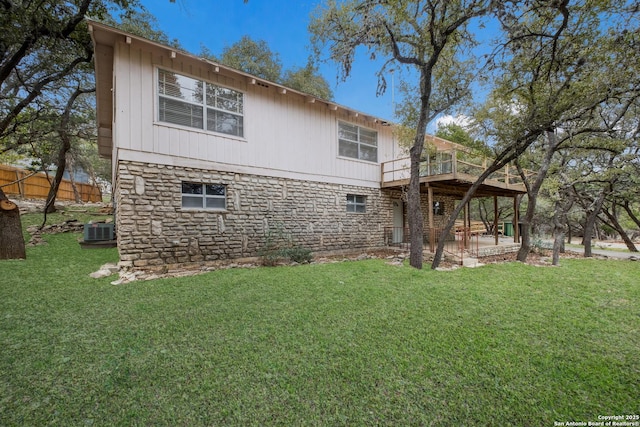 back of house featuring a yard, a patio, and central AC