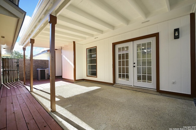 deck featuring central air condition unit and french doors