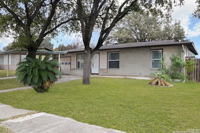 view of front of property with a front yard and a garage