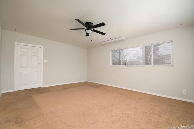 carpeted empty room featuring ceiling fan