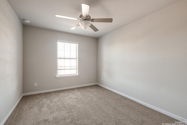 empty room featuring carpet flooring and ceiling fan