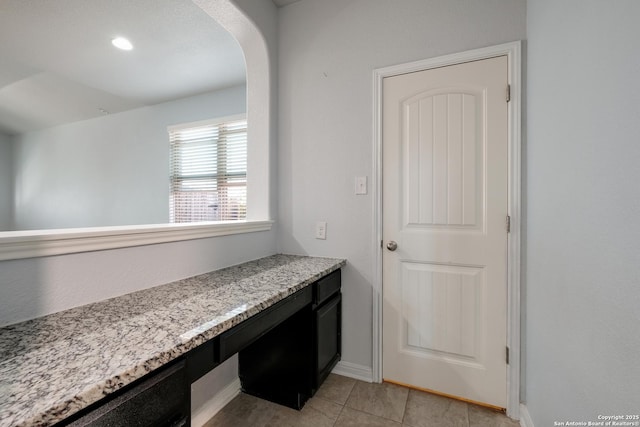 bathroom with tile patterned floors