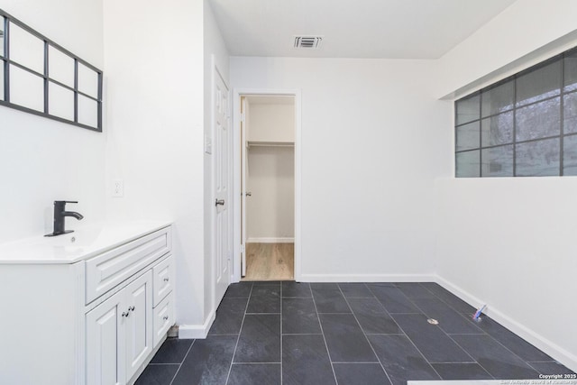 bathroom featuring tile patterned flooring and vanity