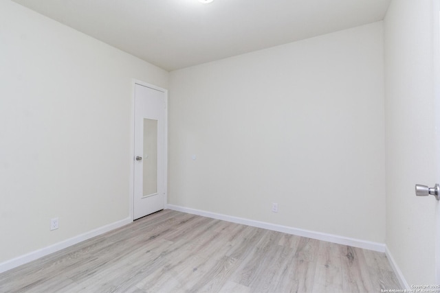 spare room featuring light wood-type flooring