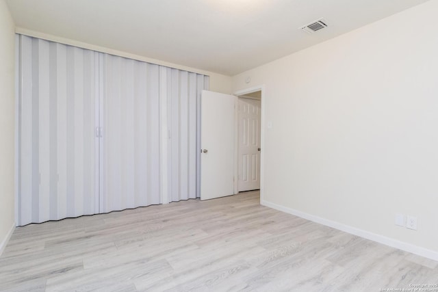 spare room with light wood-type flooring