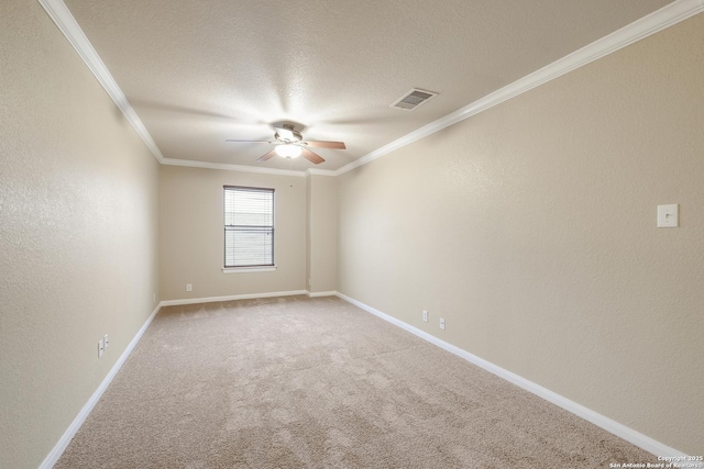 unfurnished room with ceiling fan, carpet, a textured ceiling, and ornamental molding