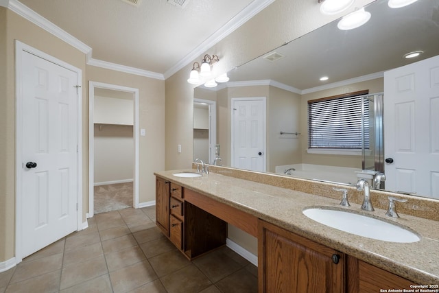 bathroom with tile patterned flooring, vanity, ornamental molding, and a tub to relax in