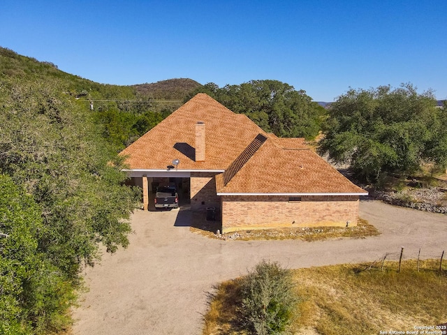 view of front of home with a carport