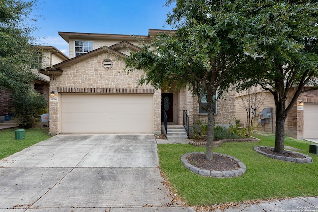 view of front of home featuring a front lawn and a garage