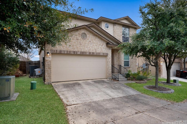 front of property with a front yard and a garage