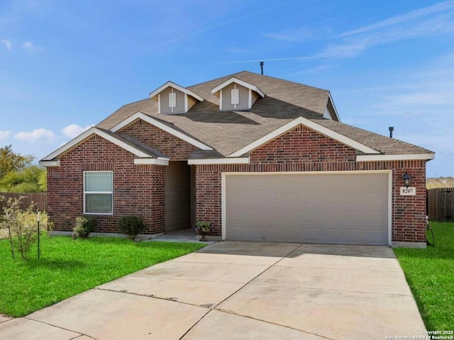 view of front of home with a front lawn and a garage