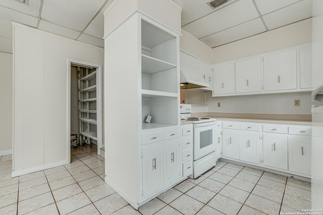 kitchen featuring white cabinets, white electric range, and custom range hood