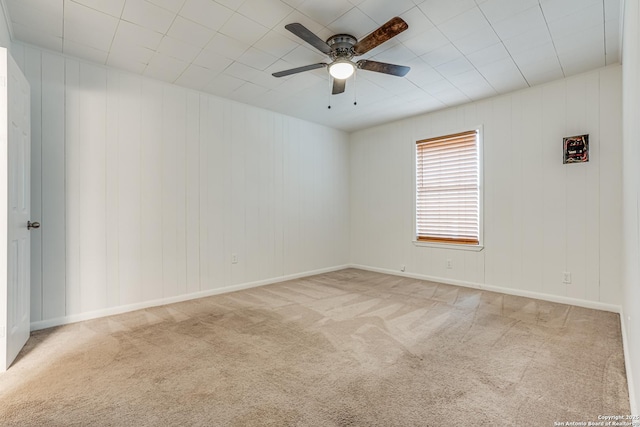 spare room featuring carpet flooring and ceiling fan