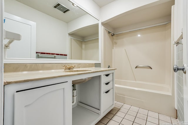 bathroom with tile patterned floors, sink, and shower / bathtub combination