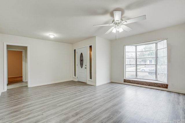 unfurnished living room with ceiling fan and light hardwood / wood-style flooring