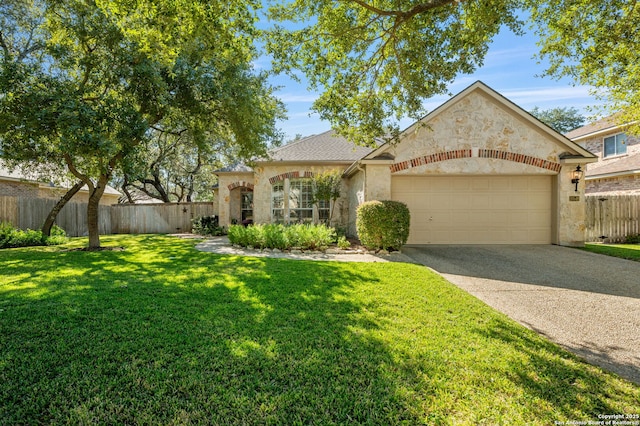 view of front of property with a front yard and a garage