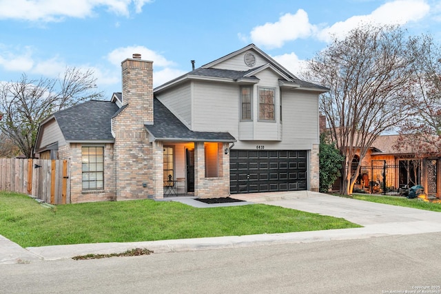 view of front of home featuring a front yard and a garage