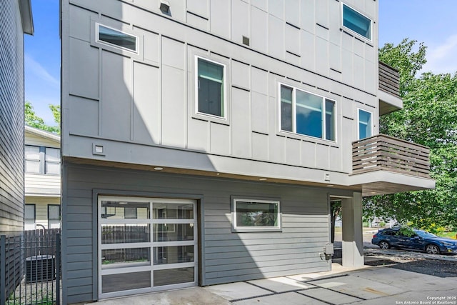 exterior space with central AC unit and a balcony