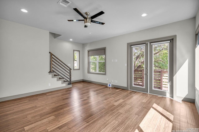 spare room featuring ceiling fan and light wood-type flooring