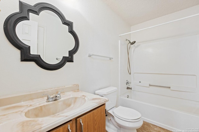 full bathroom featuring a textured ceiling,  shower combination, vanity, and toilet