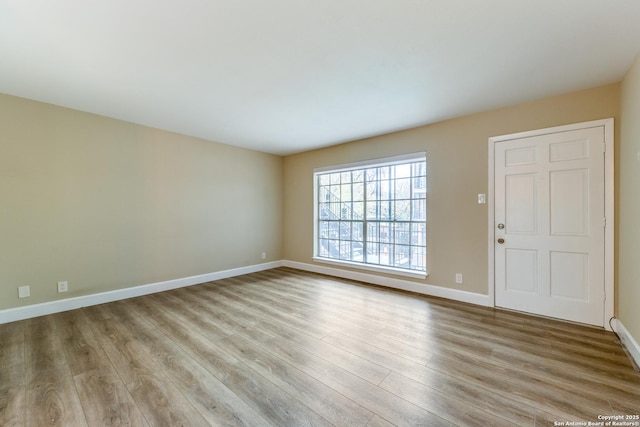 spare room featuring light wood-type flooring