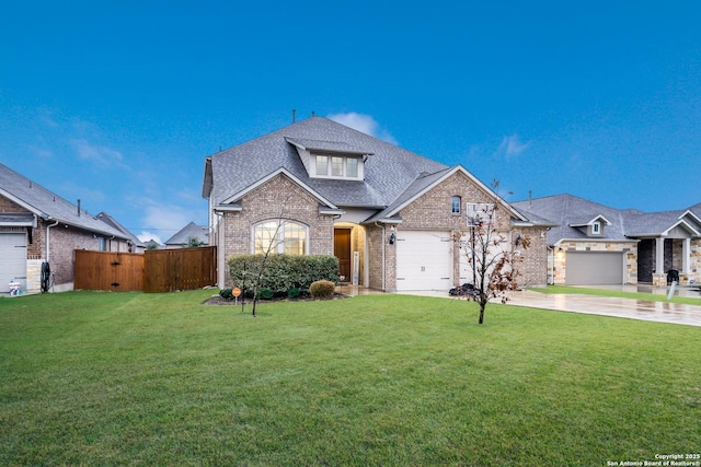 view of front of house featuring a front lawn and a garage