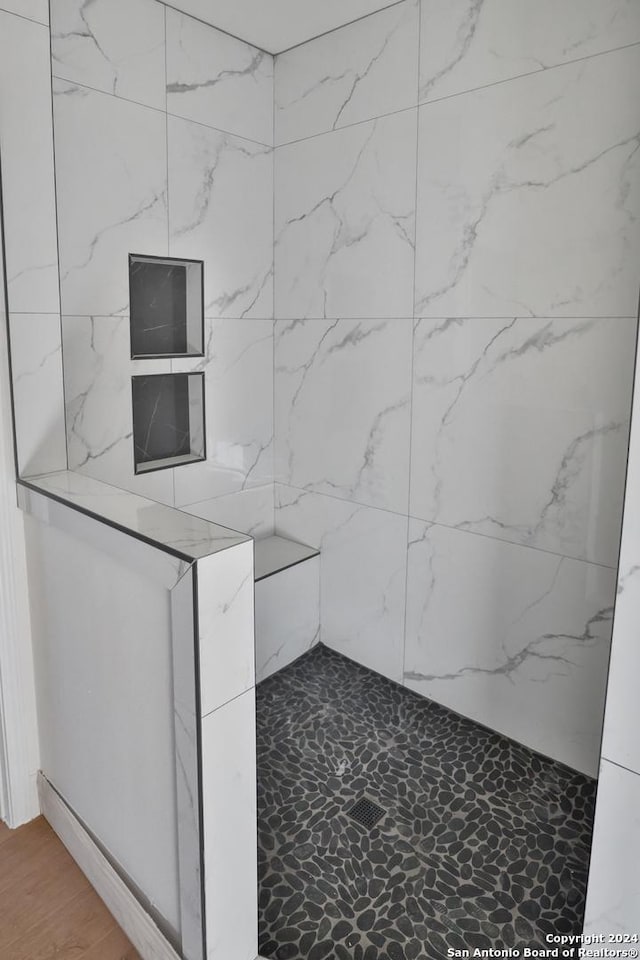 interior space with a tile shower