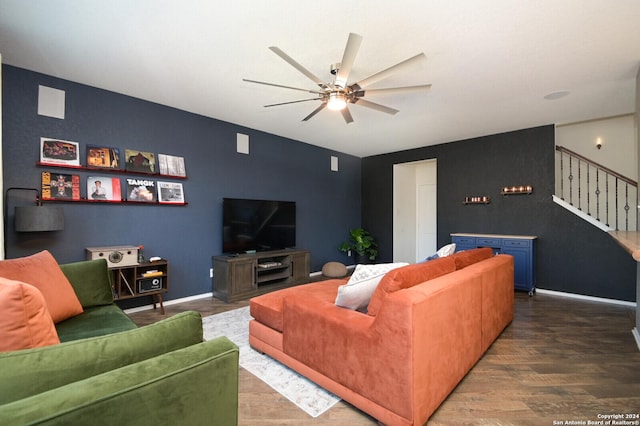 living room featuring ceiling fan and hardwood / wood-style flooring