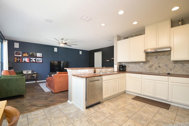 kitchen featuring kitchen peninsula, stainless steel dishwasher, ceiling fan, sink, and light tile patterned flooring