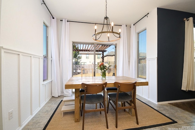 dining space featuring a chandelier