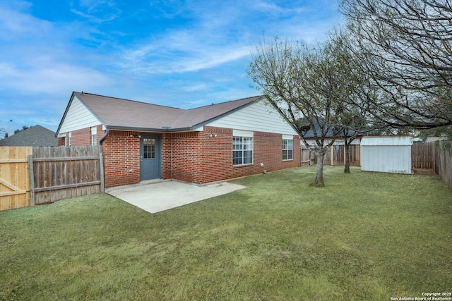 rear view of house featuring a patio area and a lawn