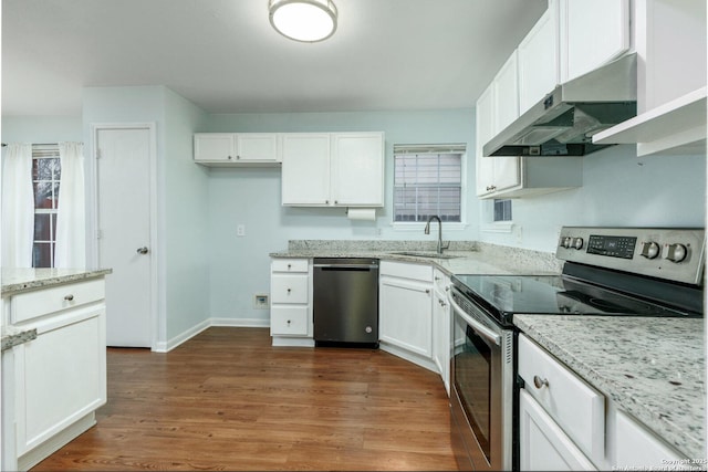 kitchen with white cabinetry, sink, stainless steel appliances, and light stone counters