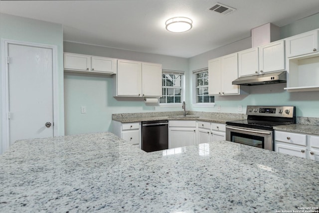 kitchen with appliances with stainless steel finishes, light stone counters, white cabinetry, and sink