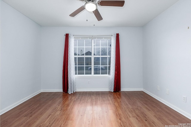 empty room featuring ceiling fan and hardwood / wood-style flooring