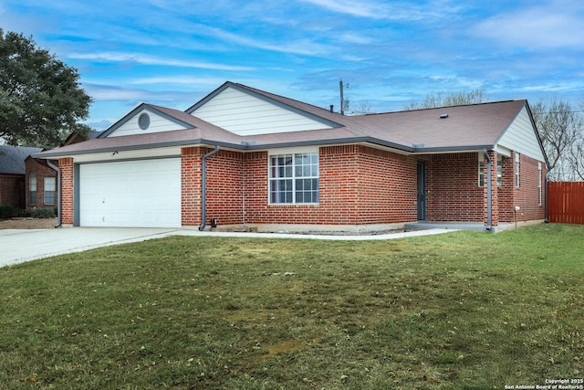 single story home featuring a garage and a front lawn