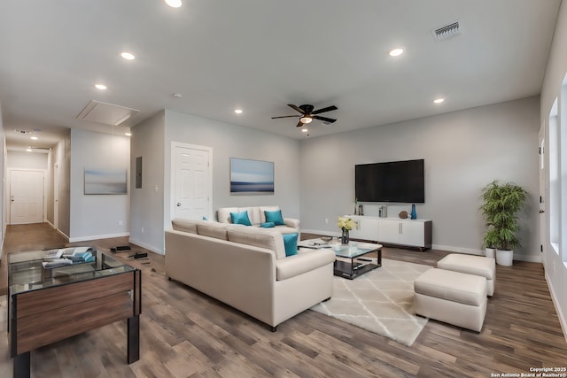 living room featuring ceiling fan and wood-type flooring