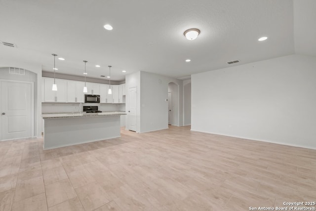 unfurnished living room with a textured ceiling