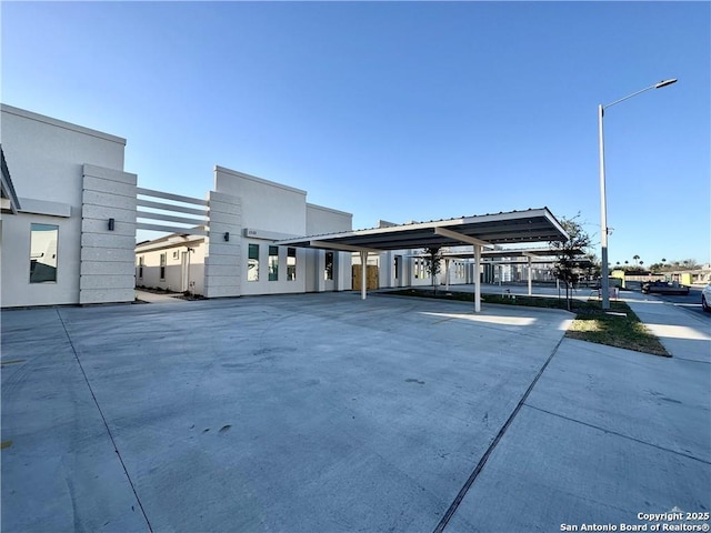 exterior space with a carport