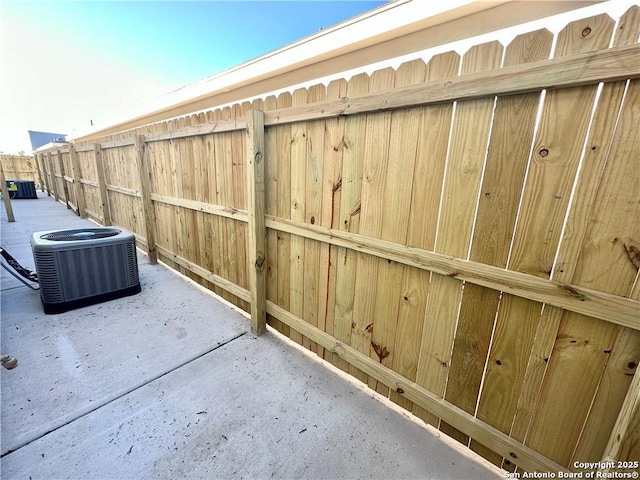 view of patio with central AC