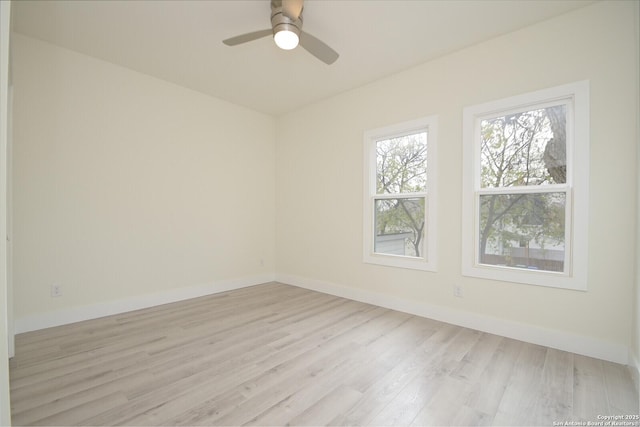 spare room with ceiling fan and light hardwood / wood-style flooring