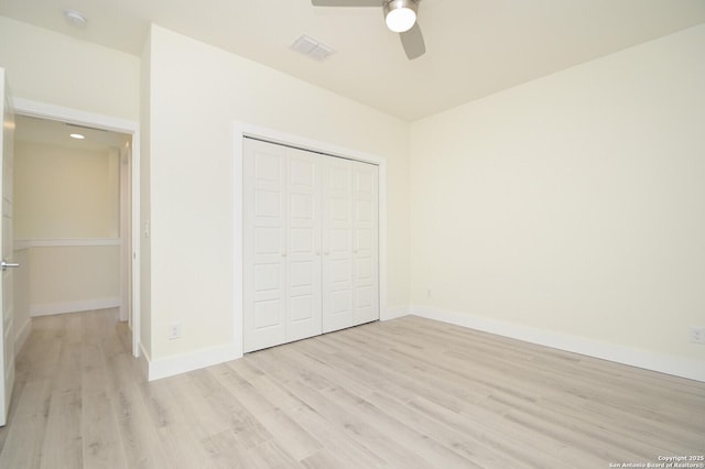 unfurnished bedroom featuring a closet, ceiling fan, and light hardwood / wood-style floors